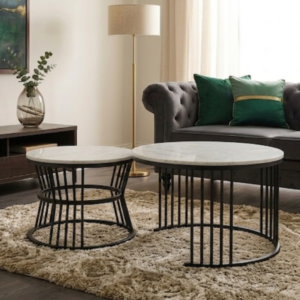 Modern Nesting Coffee Tables set of two with white marble-look tops and black geometric metal bases on a plain background