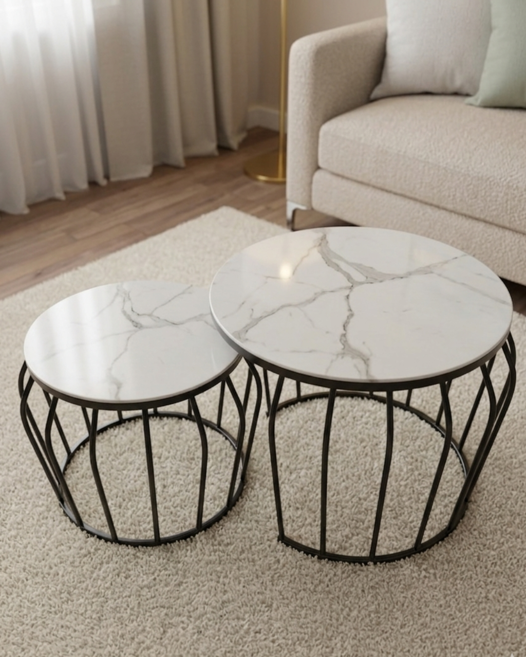 Set of two modern Nesting Coffee Tables with white marble-finish tops and black metal cage-style bases
