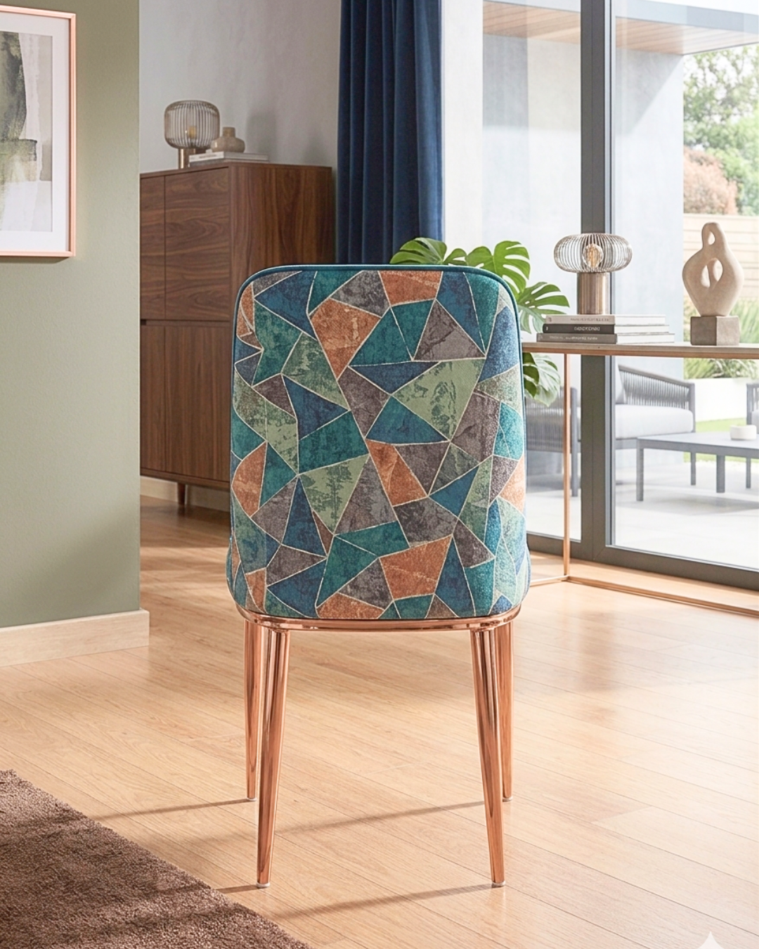 Modern Velvet Dining Chair with rose-gold legs and geometric pattern back.