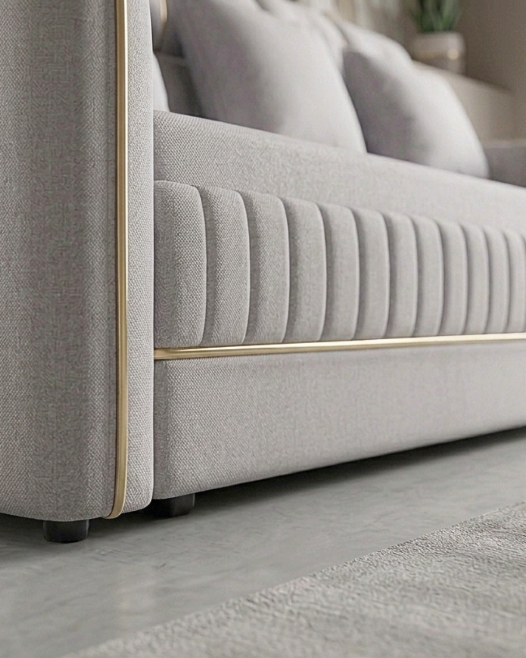 Luxury Sofa Cum Bed in light grey fabric with elegant gold accents