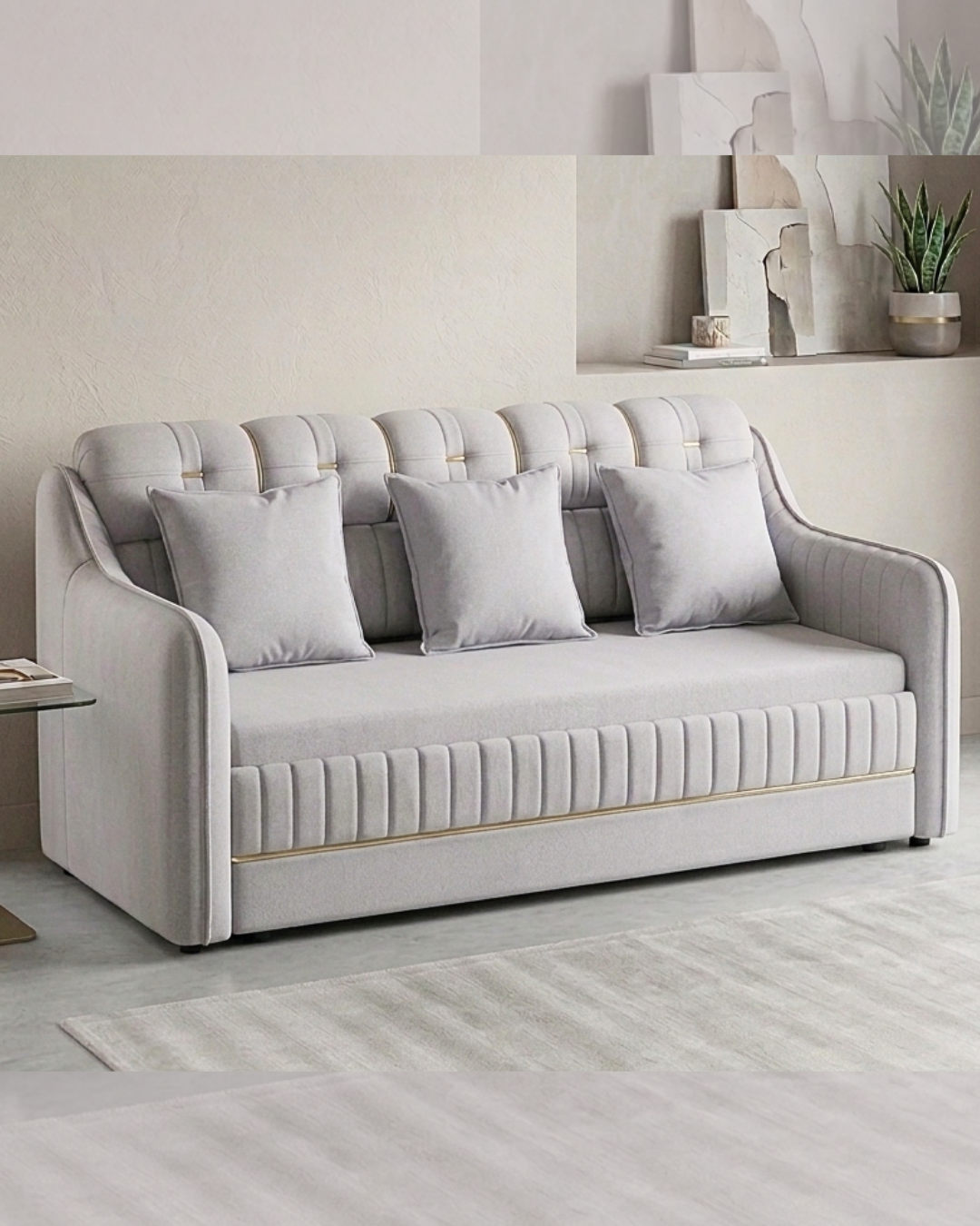 Luxury Sofa Cum Bed in light grey fabric with elegant gold accents