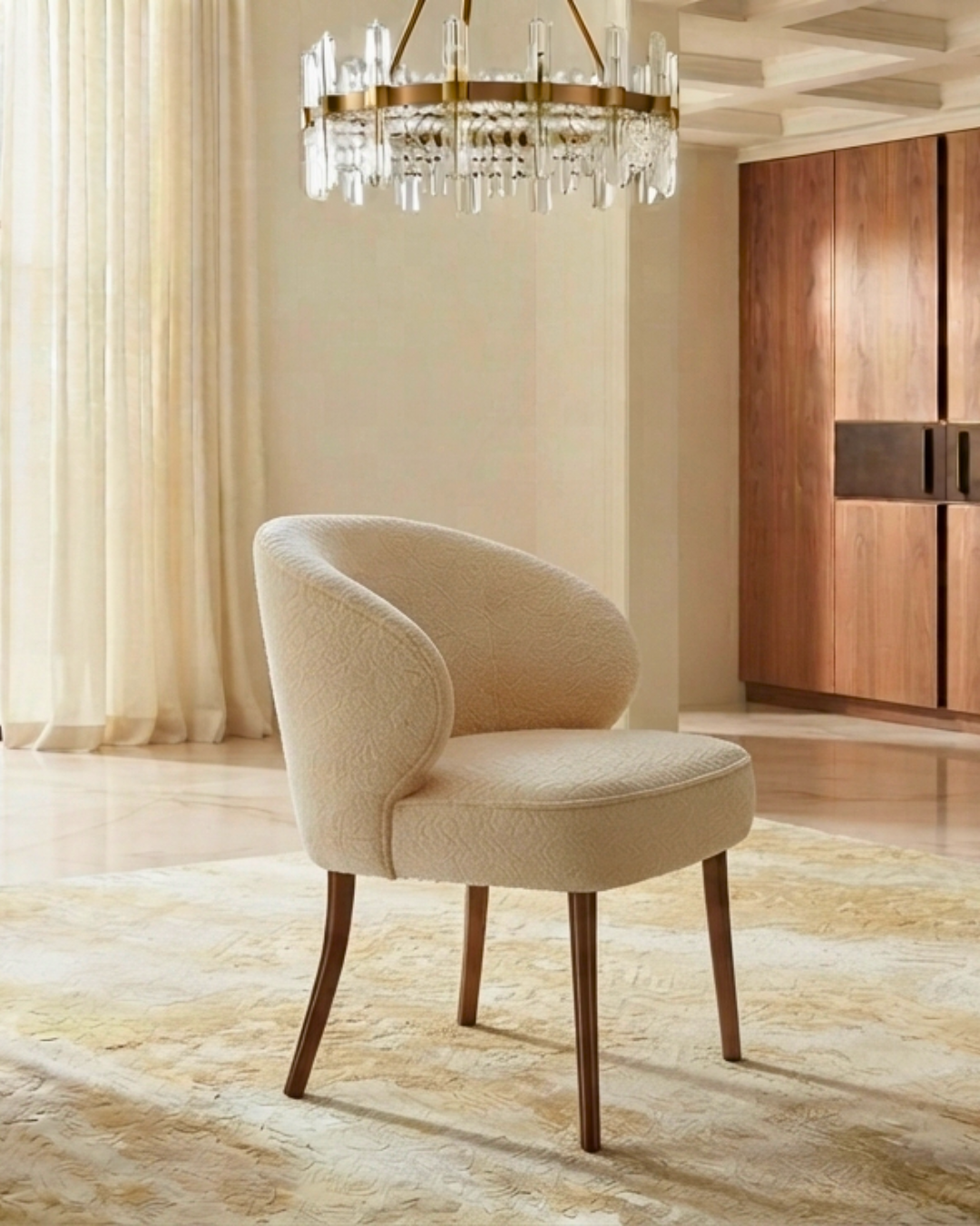Close-up of a single cream dining chair beside a luxury marble dining table.